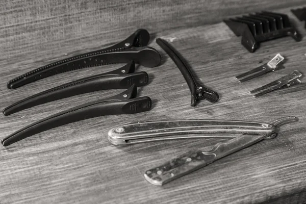 Tools hairdressers. Barber Tools on a wooden background