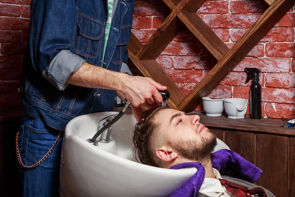 Cleaning head Barbershop. Cleaning head barber\'s. Barber washing head client. Hairdressers wash head to the client.