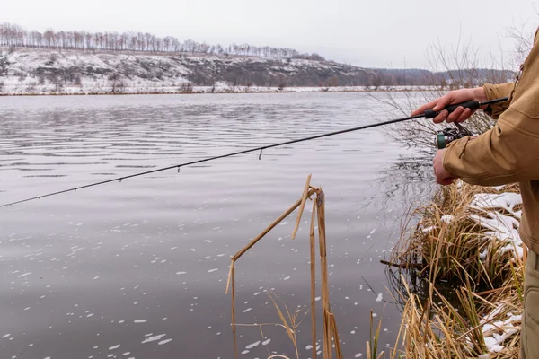 Fishing spinning on the background gorgeous landscape on the river — Stock Photo, Image