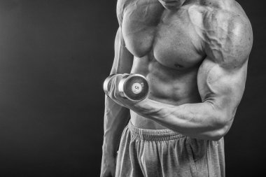 Farklı poz vücut geliştirmeci onların kas gösteren teşkil etmektedir. Karanlık bir arka plan üzerinde hata oluştu. Erkek gösteren kaslar zorlayarak. Güzel kas vücut atlet.