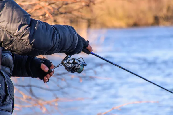 Fisherman on the river bank — Stock Photo, Image