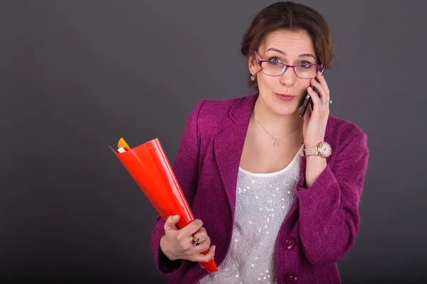 Young busy woman  in a bright suit. — Stock Photo, Image