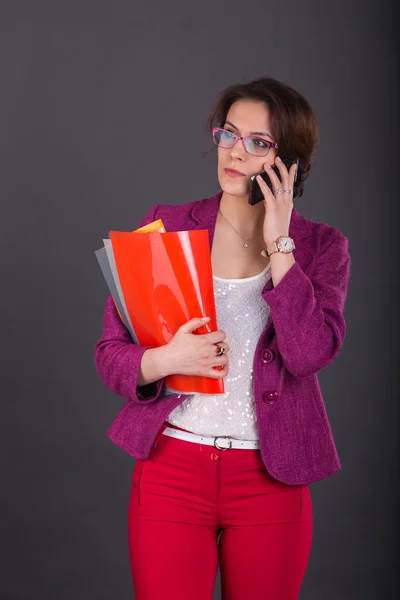 Young busy woman  in a bright suit. — Stock Photo, Image