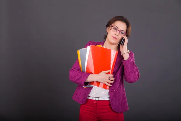 Young busy woman  in a bright suit. — Stock Photo, Image