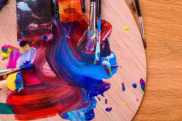 The artist's work. Multi-colored paint on canvas — Stock Photo, Image