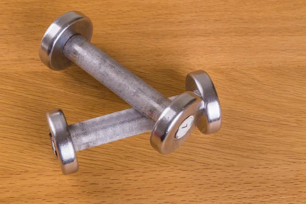 Dumbbells on a wooden background. Sports and Fitness — Stock Photo, Image