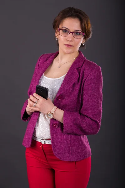 Business girl with a folder for papers and telephone — Stock Photo, Image