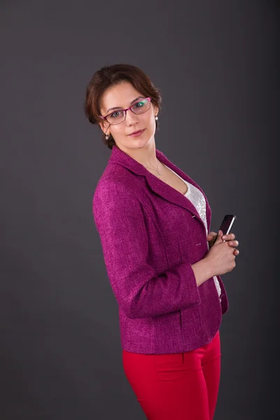 Business girl with a folder for papers and telephone — Stock Photo, Image