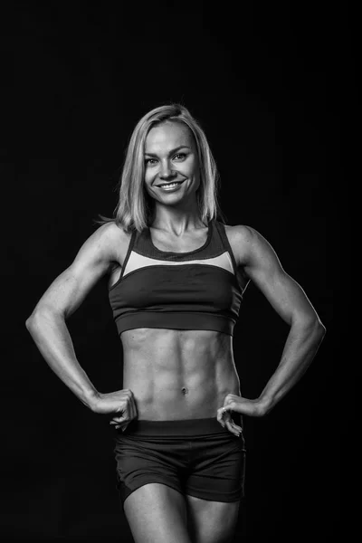 Fitness girl posing on black — Stock Photo, Image