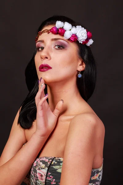 Beautiful emotional brunette in wreath — Stock Photo, Image