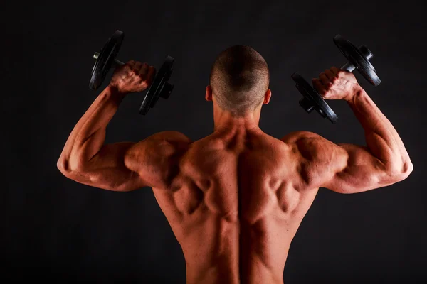 Bodybuilder avec corps musculaire de secours et haltères — Photo