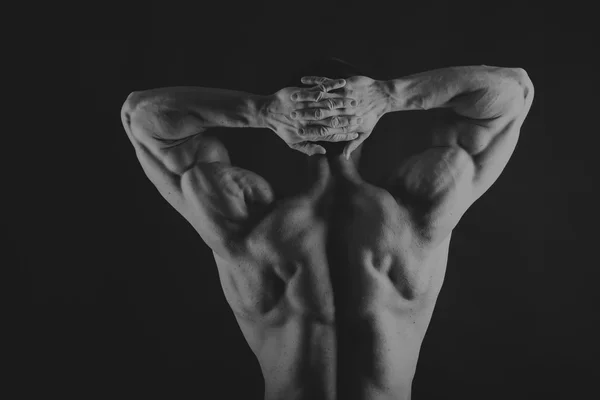 Μυώδης, bodybuilder σώμα ανακούφιση σε μαύρο φόντο. Μαύρο ένα — Φωτογραφία Αρχείου