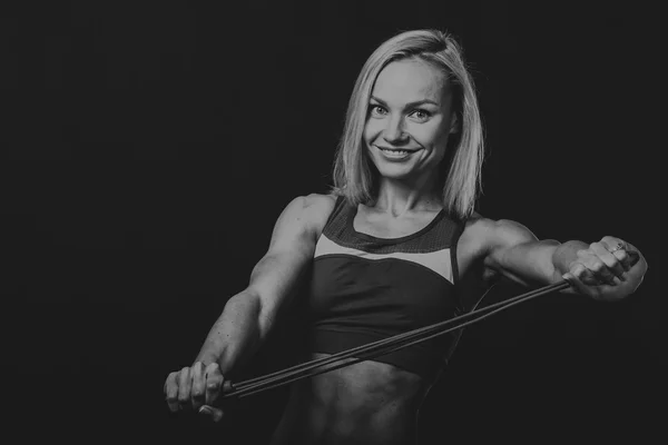 Fitness girl posing on black — Stock Photo, Image