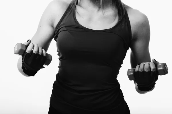 Sexy Fitness-Frau auf hellem Hintergrund. — Stockfoto