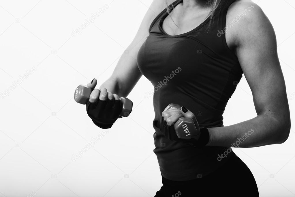 Sexy Fitness woman on a light background.