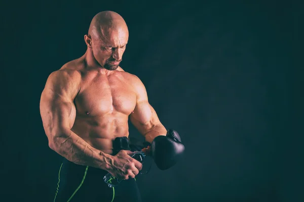 Muscular man on black — Stock Photo, Image