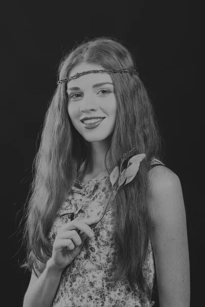 Pretty brunette with a wreath in her hair, black-and-white photo — Stock Photo, Image