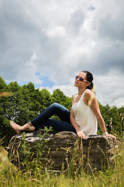 Woman on stone — Stock Photo, Image