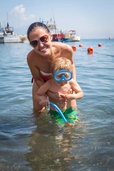 Mother and son in water — Stock Photo, Image