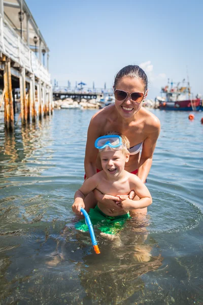 Mother and son in water — Stock Photo, Image