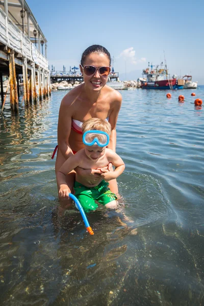 Mother and son in water — Stock Photo, Image