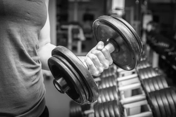 Woman holding dumbbell — Stock Photo, Image