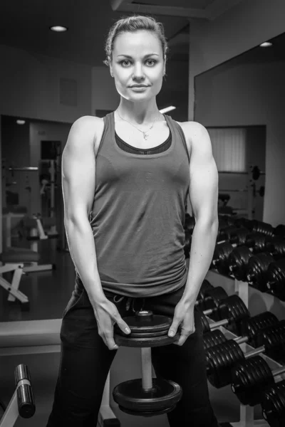 Woman holding dumbbell — Stock Photo, Image