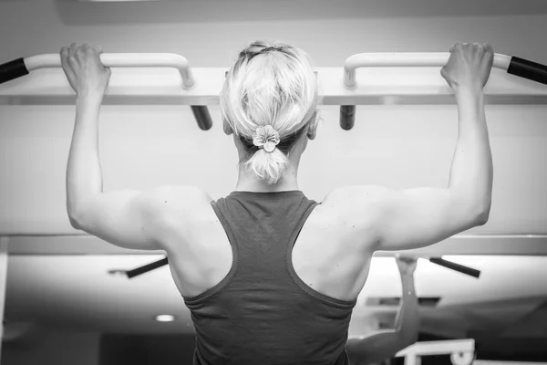 Blonde woman working out  with weights Stock Picture