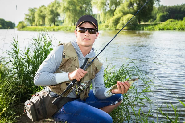 Fisherman on the river bank. — Stock Photo, Image