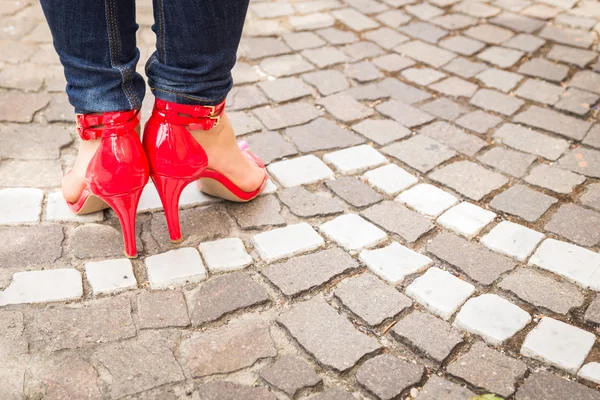 Woman legs in red high heel shoes — Stock Photo, Image