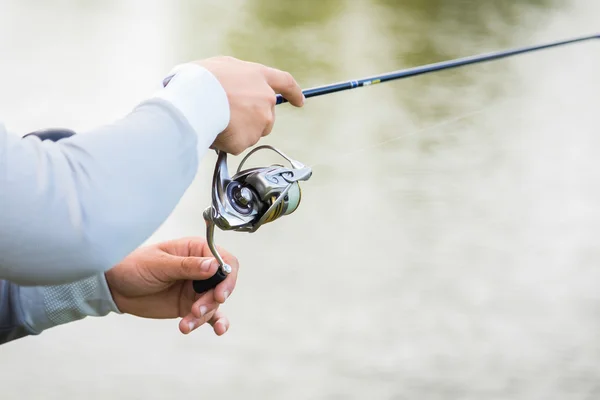 Hand holding spinning — Stock Photo, Image