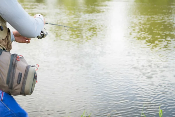 Fisherman on the river bank — Stock Photo, Image