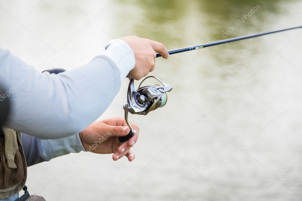 Fisherman on the river bank