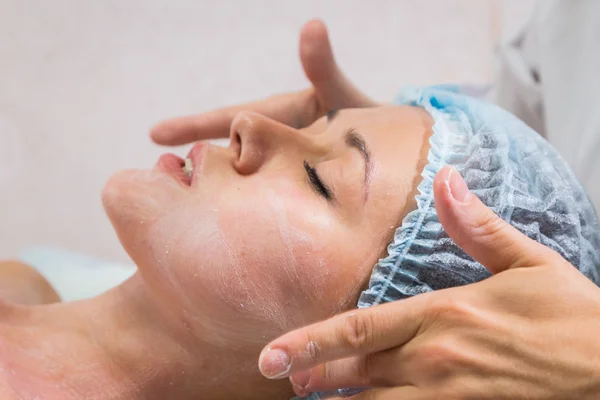 Beautiful woman with facial mask — Stock Photo, Image