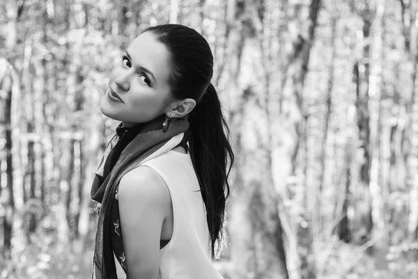 Portrait of a brunette in a forest. — Stock Photo, Image