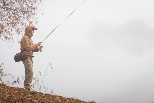 Fisherman with spinning — Stock Photo, Image