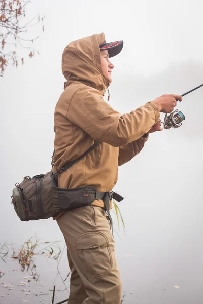 Fisherman with spinning — Stock Photo, Image