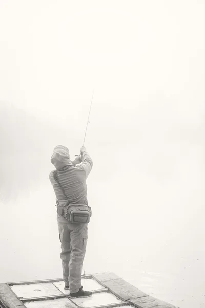 Pescador con spinning — Foto de Stock