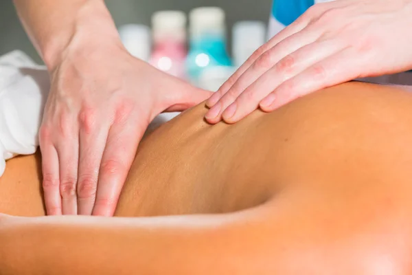 Woman having massage in a spa salon — Stock Photo, Image