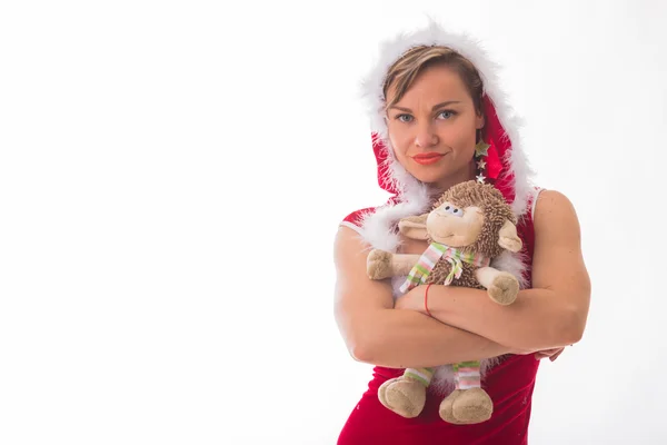 Rubia en traje de Navidad con cordero de juguete —  Fotos de Stock
