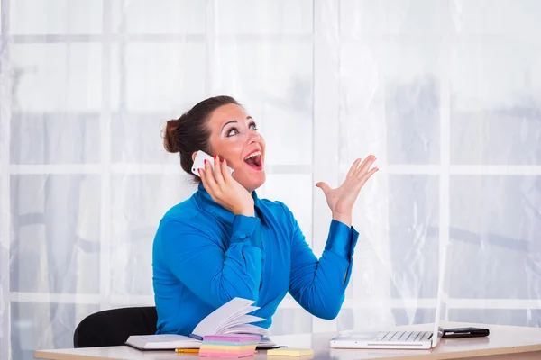 Emotional businesswoman working in office — Stock Photo, Image