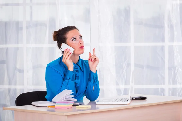 Emotional businesswoman working in office — Stock Photo, Image