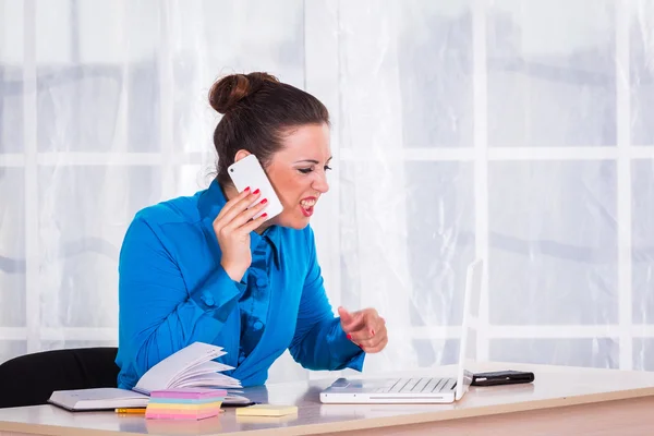 Emotional businesswoman working in office — Stock Photo, Image