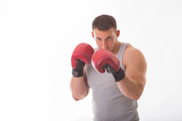 Strong man in red boxing gloves — Stock Photo, Image