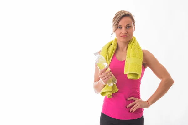 Athletic girl holding a bottle of water — Stock Photo, Image