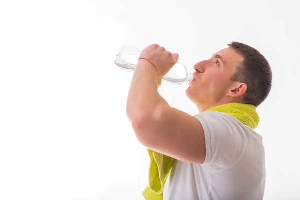 Bodybuilder with bottle of water — Stock Photo, Image
