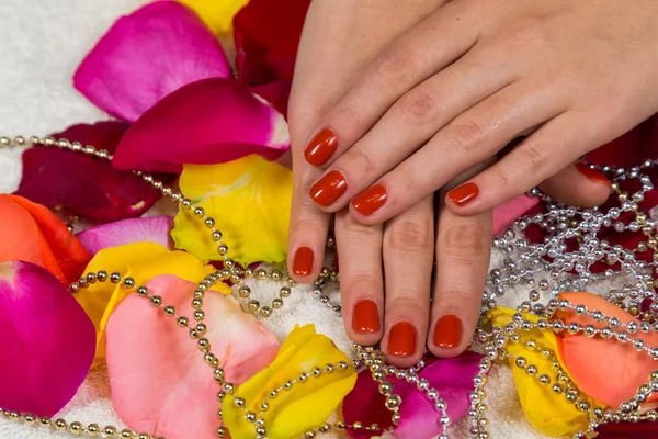 Manicured hands with red nail polish — Stock Photo, Image