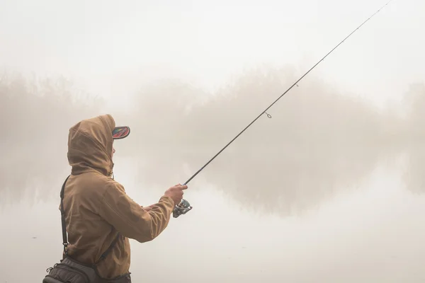 Fisherman with spinning — Stock Photo, Image