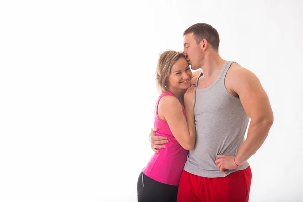 Athletic couple in sportswear — Stock Photo, Image