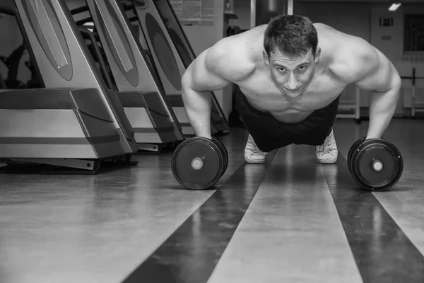 Man doing workout with heavy dumbbell — Stock Photo, Image